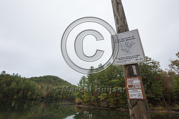 Sign warning against the spread of non-native species, Santeetla