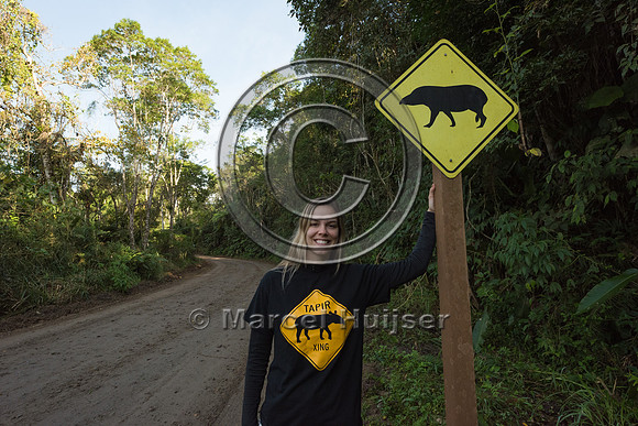 Fernanda Abra with warning sign for South American tapir (Tapiru