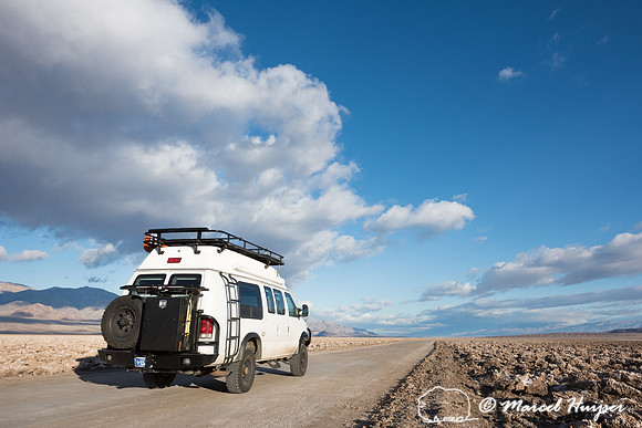 Camper van on dirt road, Devil's golf course, Death Valley Natio