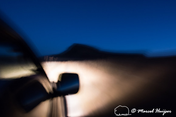 Car on dirt road at night, Chapada dos Veadeiros National Park,