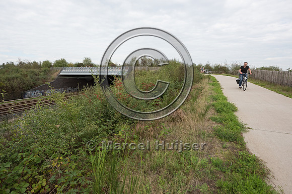 Hiking and biking trail combined with wildlife overpass across r