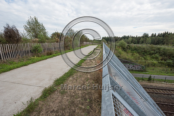 Hiking and biking trail combined with wildlife overpass across r