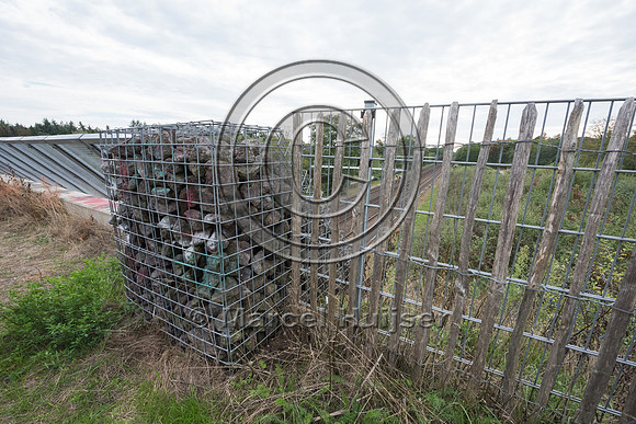 Fence along hiking and biking trail on wildlife overpass Op Hees