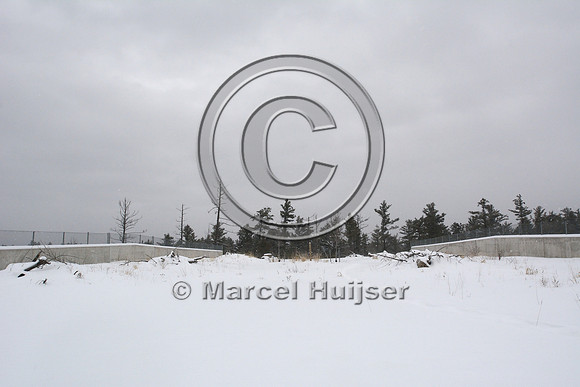 Top of wildlife overpass with cover (tree branches and rocks), Hwy 69, Ontario, Canada