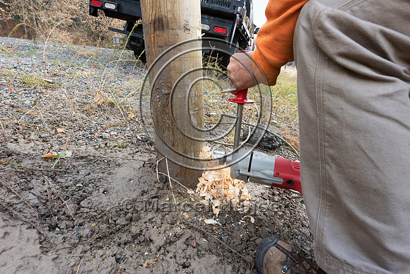 Break-away holed drilled in post with research equipment. Electi