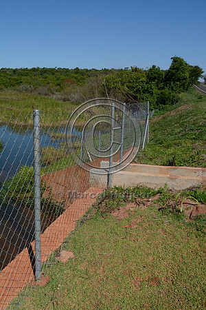 Drainage from road under wildlife fence SP-270 about 70 km south east of Presidente Prudente, São Paulo, Brazil