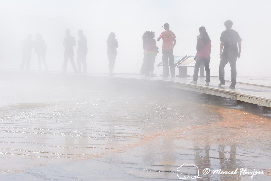 People on boardwalk at Grand Prismatic Spring, Midway Geyser Basin, Yellowstone National Park, Wyoming, USA
