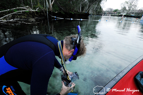 Checking the underwater bag for my camera before photographing the manatees at Crystal River, Florida, USA