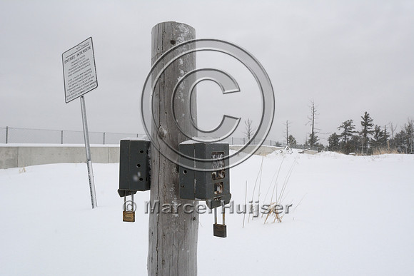 No tresspassing sign and wildlife cameras at wildlife overpass, Hwy 69, Ontario, Canada