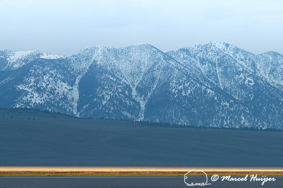 Mountain slope and water in Centennial Valley, Montana, USA
