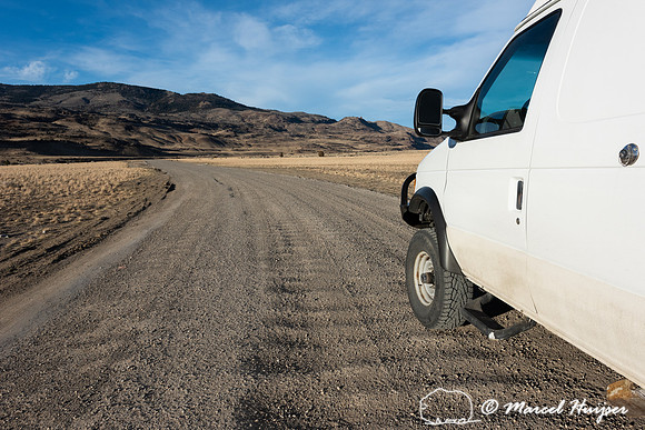 Camper van on dirt road, Montana