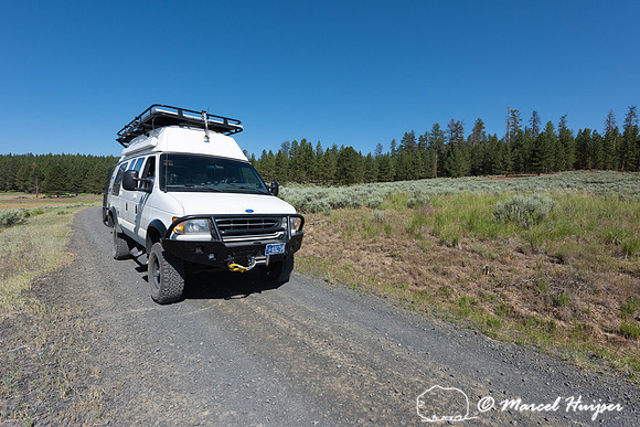 Camper van on gravel road, Malheur National Forest, Oregon