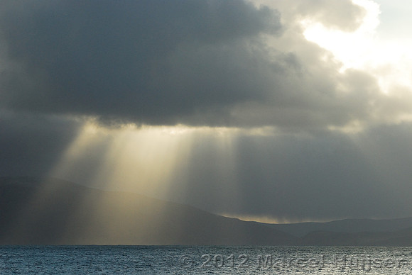 Sun beams and clouds over Dingle Bay and the Kerry Peninsula, Ireland