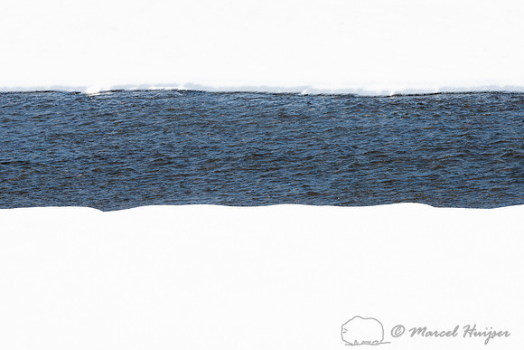 A river runs through it, Wyoming, USA. River through snow field.