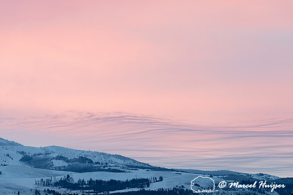 Pink winter sky and wavy clouds, Wyoming