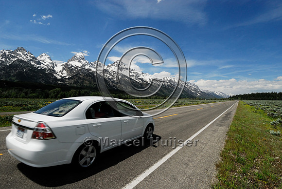 Car with Grand Tetons, Teton Park Rd, Grand Teton National Park, WY