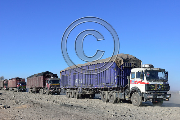 Coal trucks approaching Gashuun-Sukhait, Gobi, Mongolia