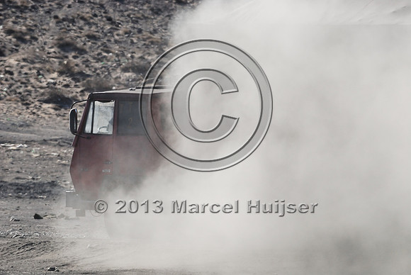 Coal trucks hauling coal to the border and dust, between Tsagaan khad (White Rock) and Gashuun-Sukhait, Gobi, Mongolia