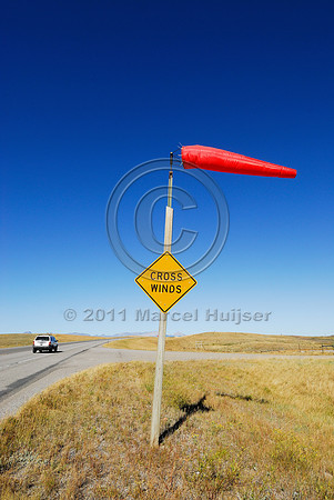 Cross winds warning sign and windsock, MT