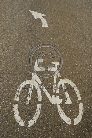 Bicycle route sign on pavement on top of multifunctional overpass (wildlife, bicyclists, pedestrians; about 100 m wide), across A4 motorway, Parndorf, Austria
