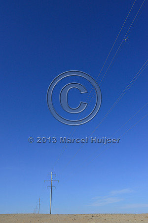 Power lines with markers for birds to reduce bird strikes, between Hanbogd and Oyu Tolgoi, near Hanbogd, Ömnögovi, Mongolia