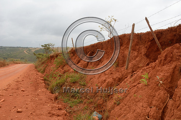 Erosion along a dirt road, loss of pasture land and damaged fence,, near São Roque de Minas, Minas Gerais, Brazil