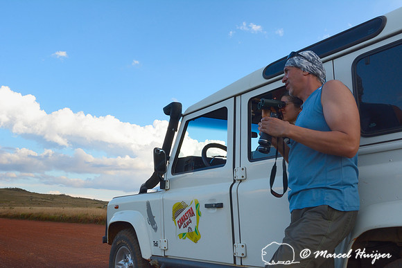 Marcello (Canastra 4x4) and Bethanie Walder scan the landscape for wildlife, Parque Nacional da Serra da Canastra, Minas Gerais, Brazil