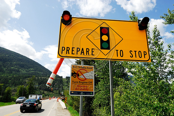 Air quality sign at construction site, British Columbia, Canada. Motorists are asked to turn off the engine off as they wait for the light to turn green at the construction site.