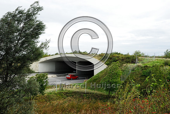 Approach of multifunctional overpass, across A4 motorway, Parndorf, Austria