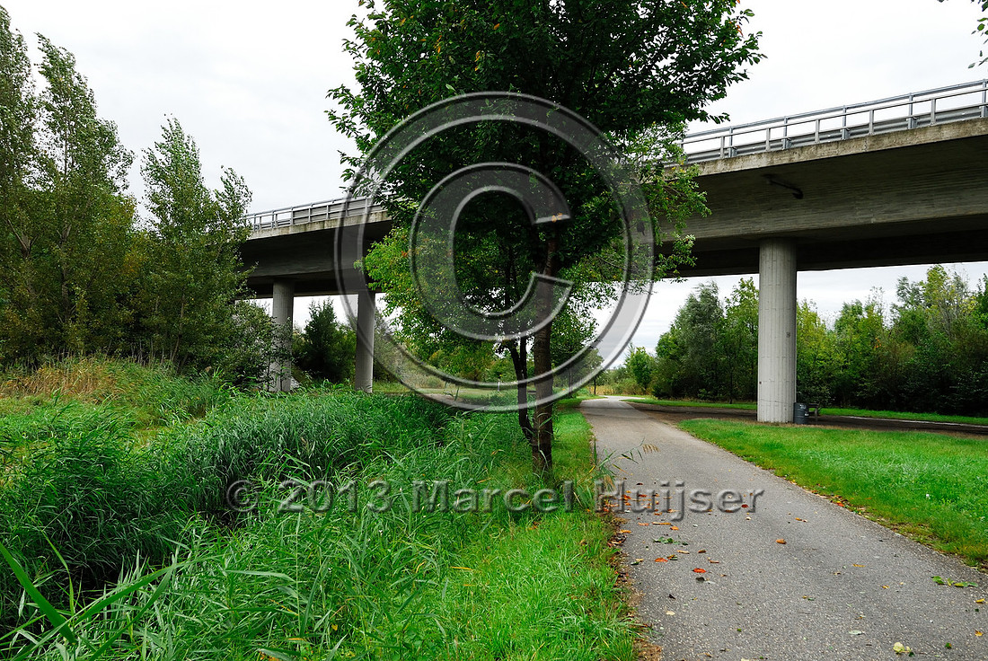 Farm road, ditch and bike pedestrian pathway, multifunctional underpass, across A4 motorway, Parndorf, Austria.