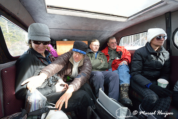 Traveling from West Yellowstone to Old Faithful with a snowcoach in winter, Yellowstone National Park, Wyoming, USA