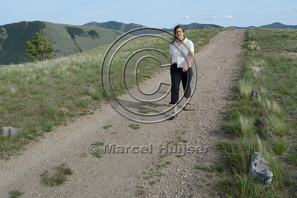 Hiker on path delineated with rocks, Waterworks Hill, Missoula, Montana, USA