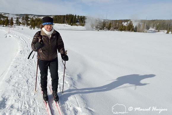 Bethanie Walder on skis, Upper Geyser Basin, Yellowstone National Park, Wyoming, USA