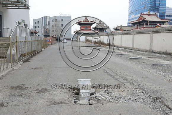 Pothole in street, Ulaanbaatar, Mongolia