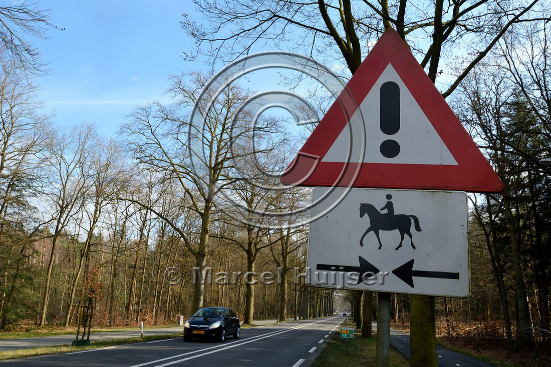 Warning sign, horses and riders crossing highway, near Hilversum, The Netherlands