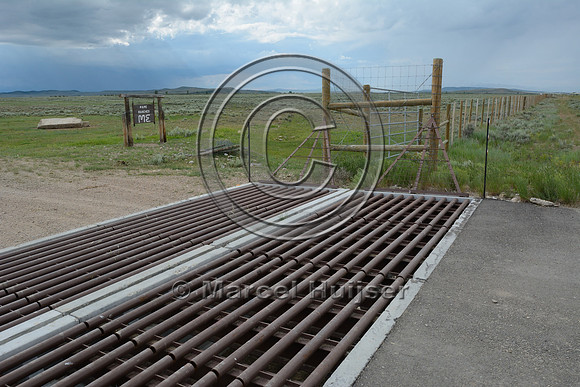 Double wide cattleguard to exclude wild ungulates from fenced road corridor, US Hwy 191, North of Daniel Jct, near Pinedale, Wyoming, USA