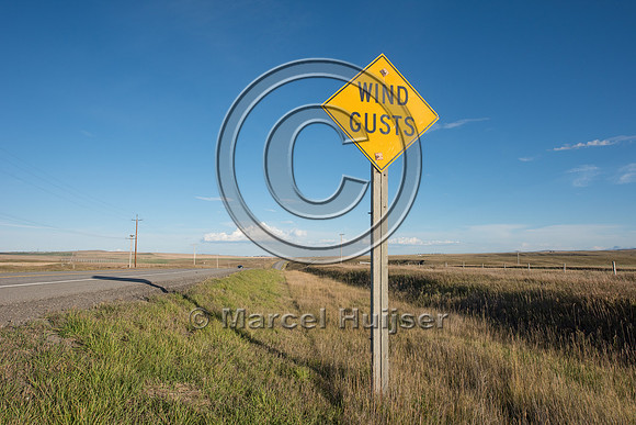 Warning sign for strong winds, near Cowley, Alberta, Canada