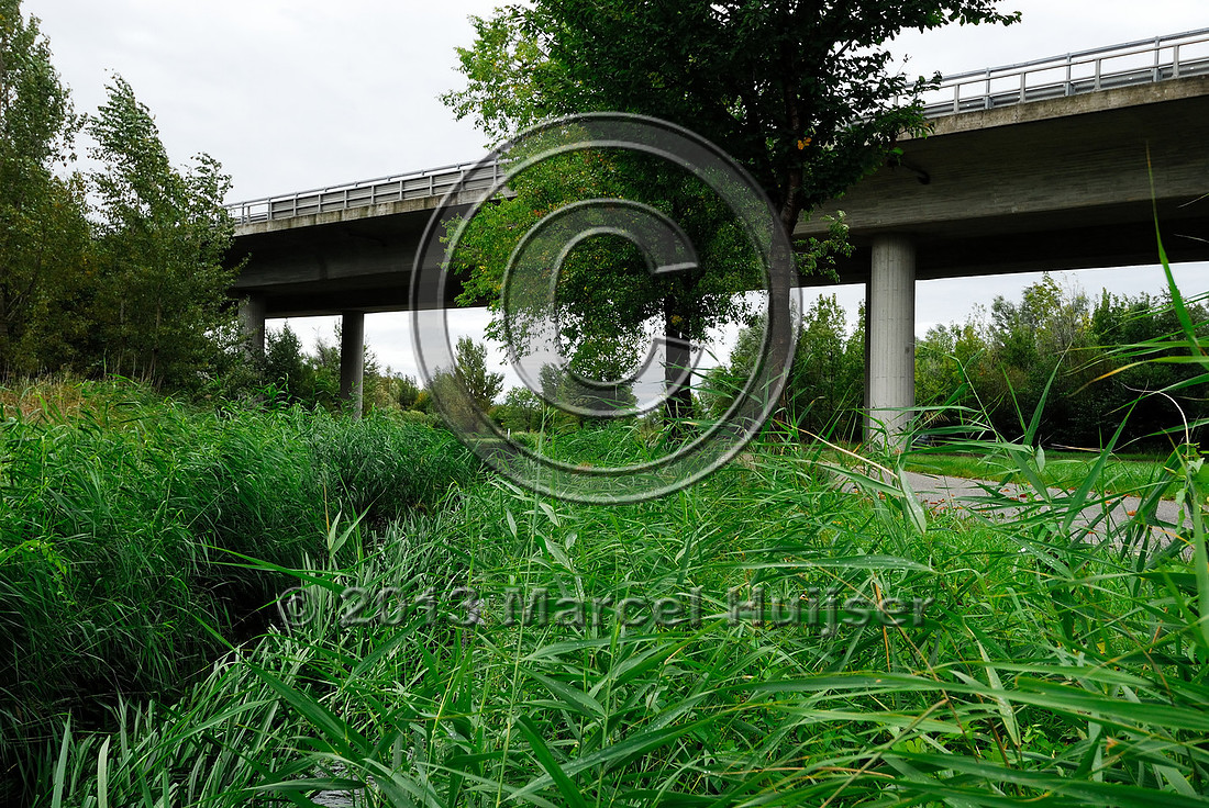Farm road, ditch and bike pedestrian pathway, multifunctional underpass, across A4 motorway, Parndorf, Austria.