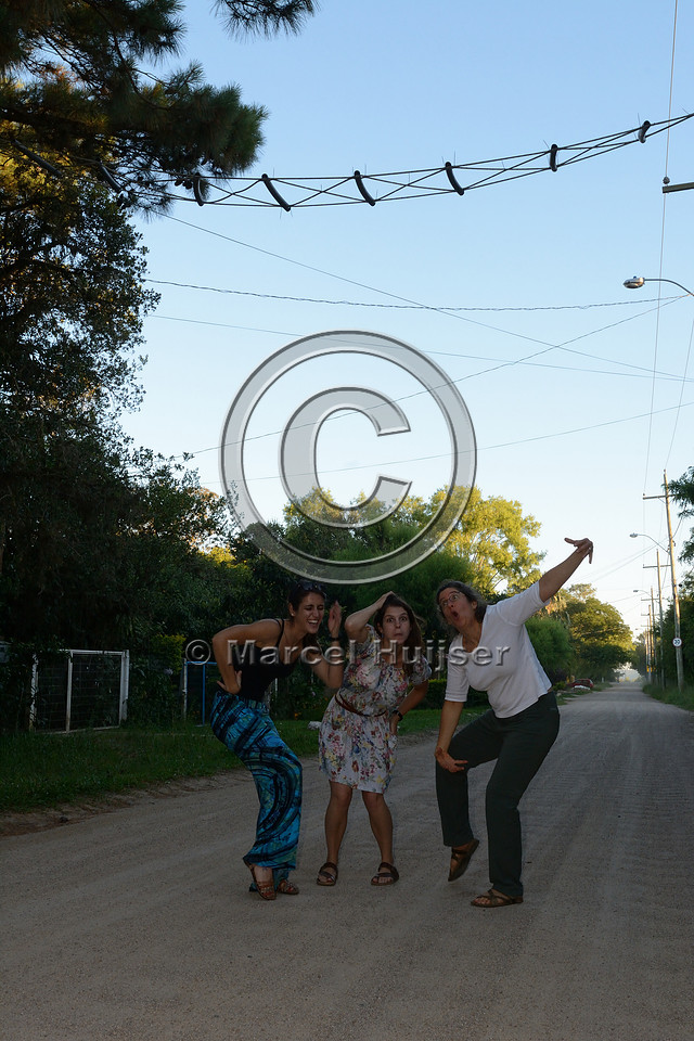 Larissa Oliveira Gonçalves, Fernanda Zimmermann Teixeira and Bethanie Walder doing their monkey thing at a canopy crossing, near Porto Alegre, Rio Grande do Sul, Brazil
