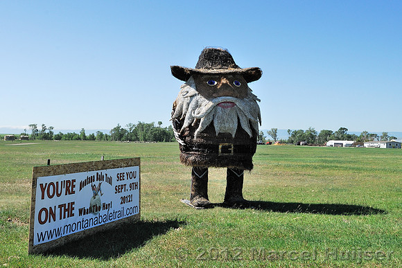 Hay bale sculpture, bearded man, Montana, USA
