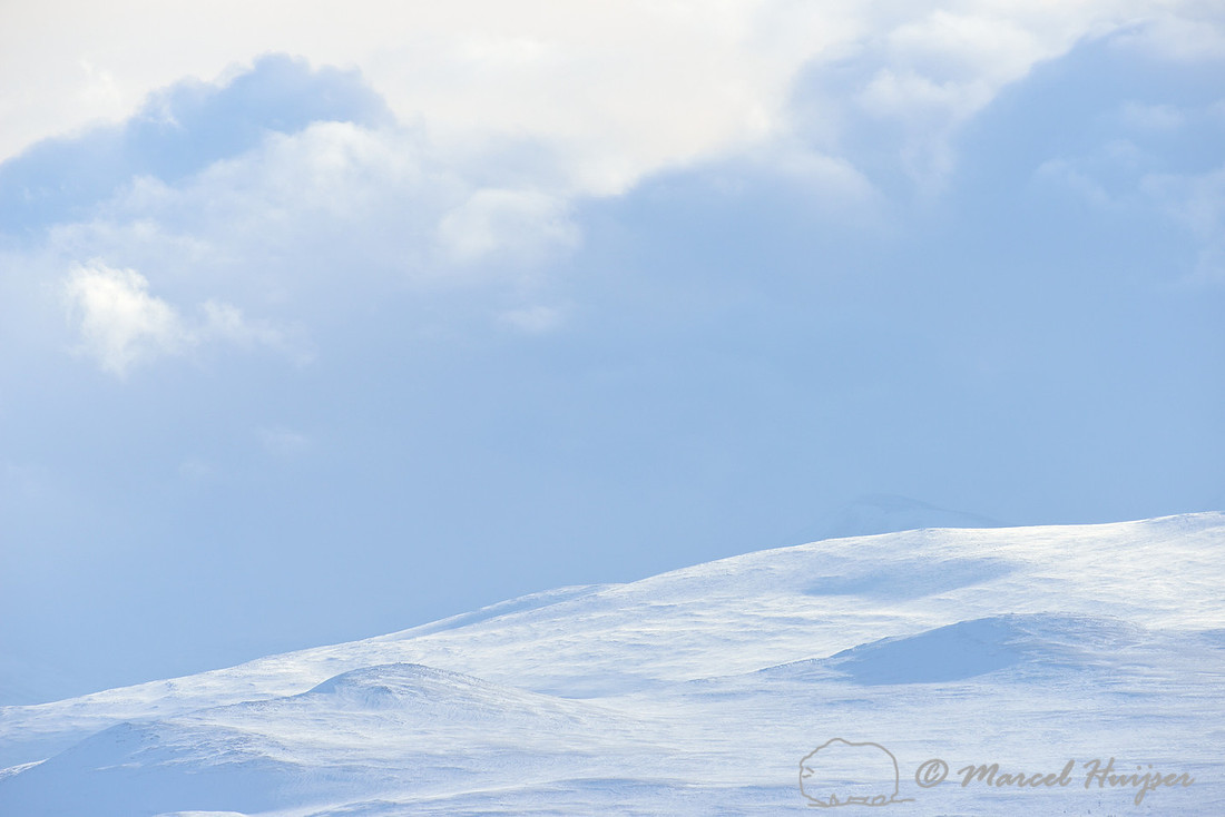 Clouds over snowy landscape, Dovrefjell National Park, Norway