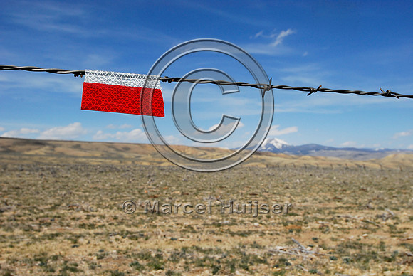Markers on livestock fences or right-of-way fences to reduce sage grouse colliding with these fences, near Bannack, Montana, USA