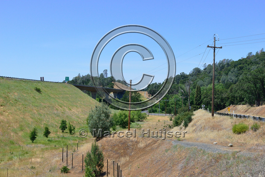 Multifunctional underpass (road and wildlife) and wildlife fence, near Sonora, California, USA