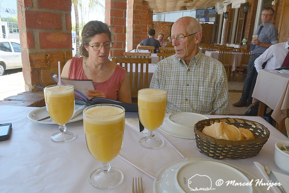 Bethanie Walder and Piet Huijser with fruit drinks (orange mixed with passion fruit) at Restaurante Carro Boi , Piracicaba, São Paulo, Brazil