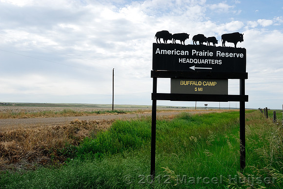 Road sign American Prairie Reserve Headquarters, Buffalo camp 5 mi, near Sun Prairie, Montana, USA