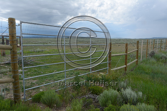 Gate next to double wide cattleguard, US Hwy 191, North of Daniel Jct, near Pinedale, Wyoming, USA