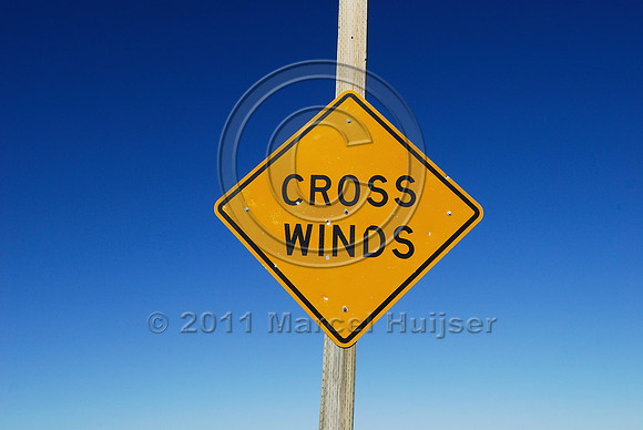 Cross winds warning sign and windsock, MT