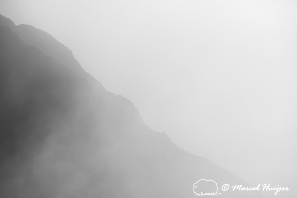 Cliffs in morning fog above Yellowstone River at Tower Falls, Wy