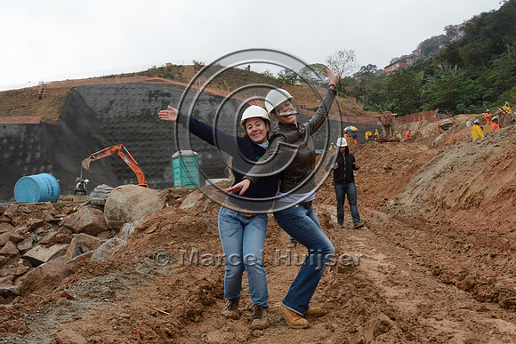 Jamille Consulin and Fernanda Abra at construction site of the northern outer beltway (Rodoanel Norte) through former favela (slums), São Paulo, Brazil