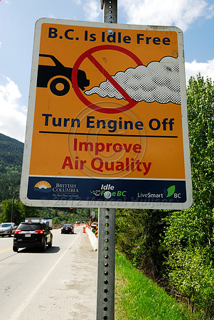 Air quality sign at construction site, British Columbia, Canada. Motorists are asked to turn off the engine off as they wait for the light to turn green at the construction site.